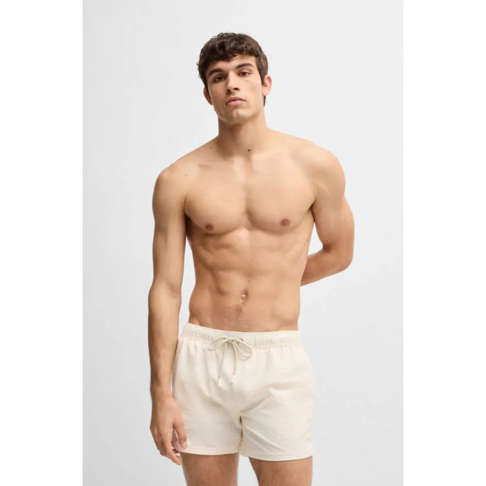 Swim shorts in striped seersucker fabric