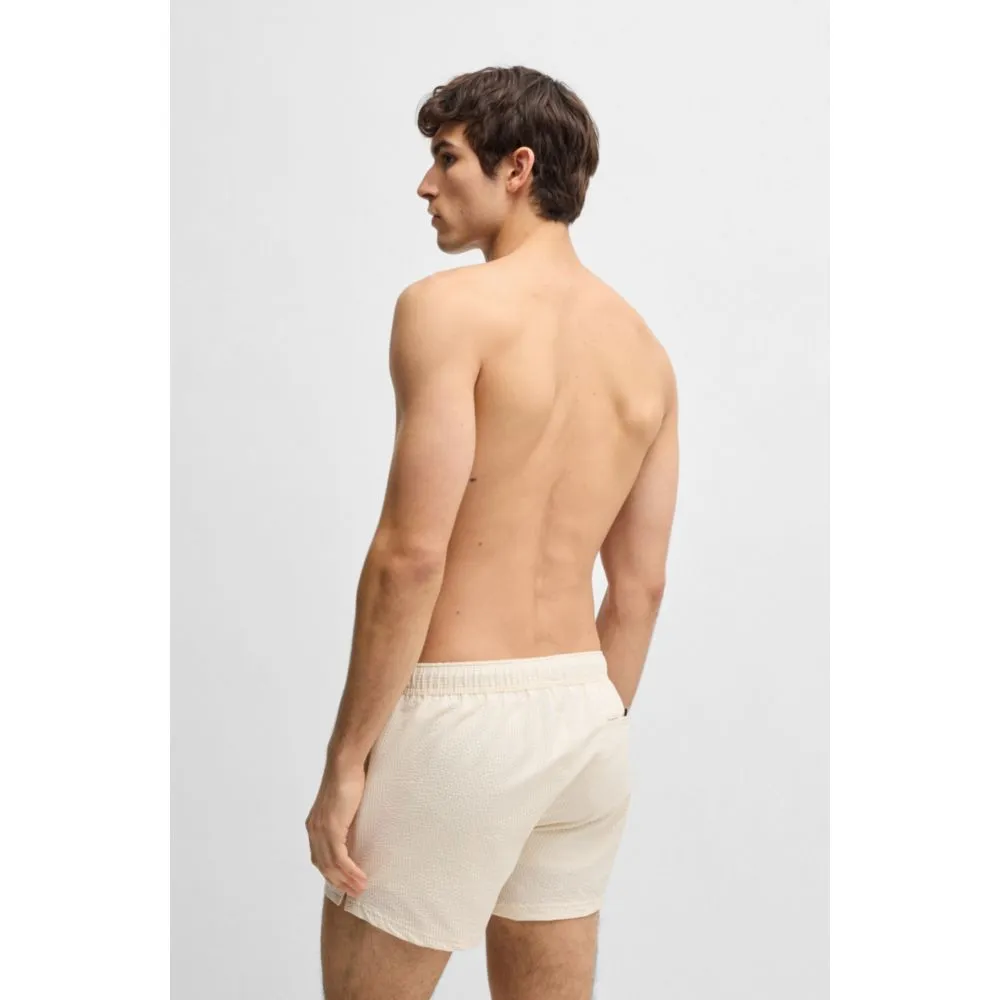Swim shorts in striped seersucker fabric